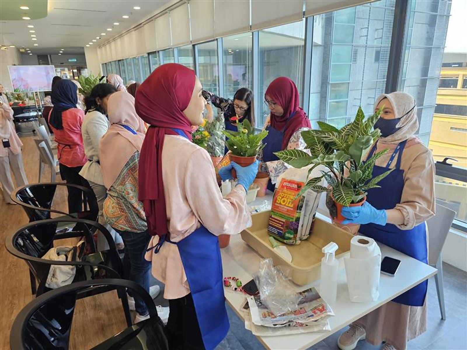 Participants sharing their potted plants during a GrowJoy workshop