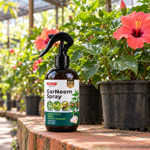 Serbajadi GarNeem Garden Pest Spray beside flowering plants.