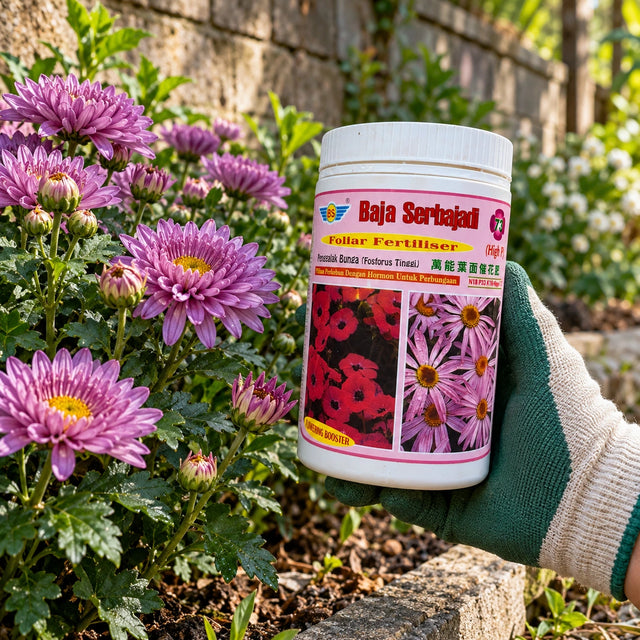 Serbajadi High P Flowering Booster 73 held beside flowering plants.