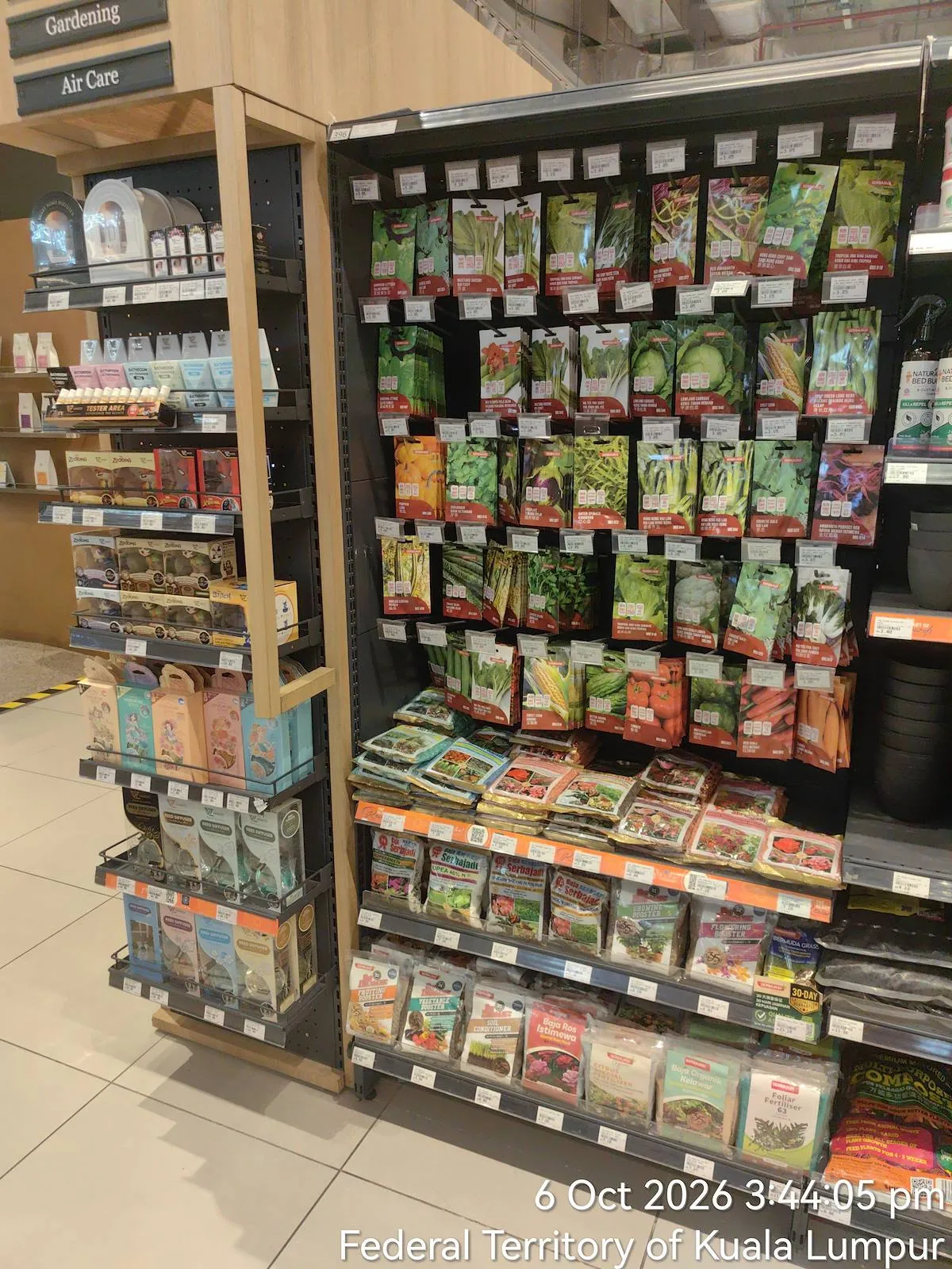 Actual Serbajadi seed packets and gardening products on a supermarket display in Kuala Lumpur