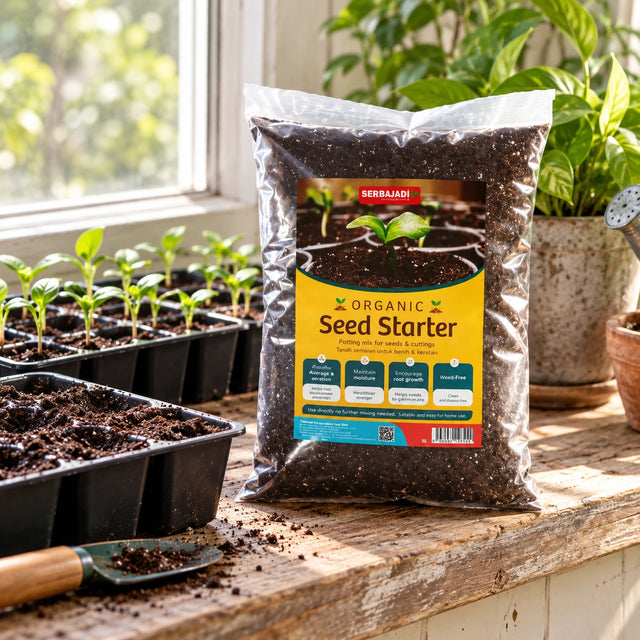 Serbajadi Organic Seed Starter beside seedling trays on a potting bench.